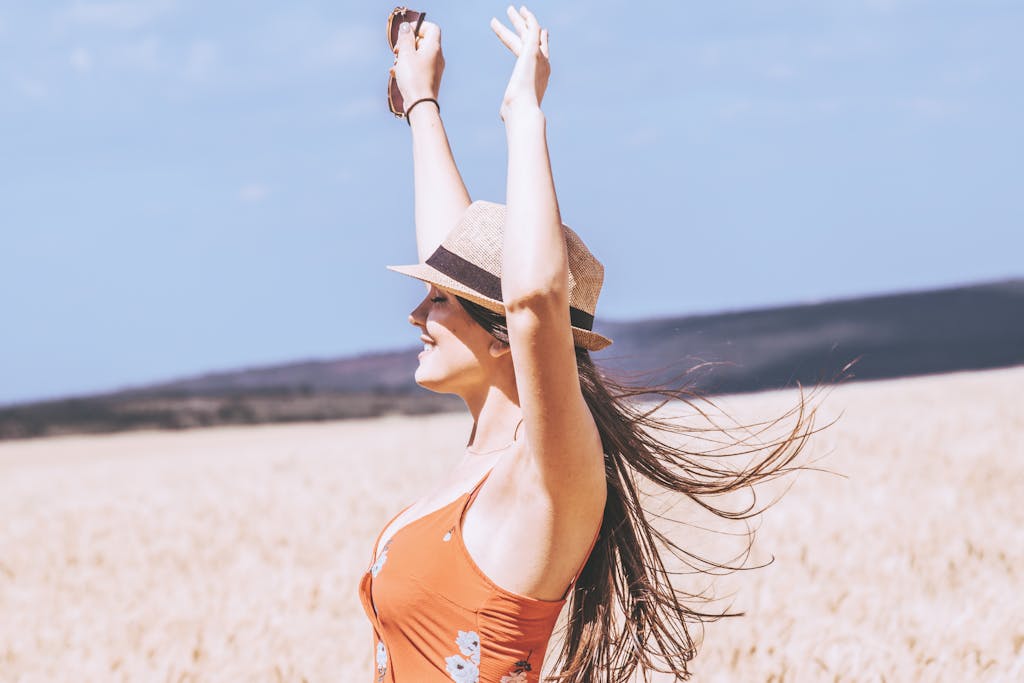 Photo of Woman Raising Her Both Arms