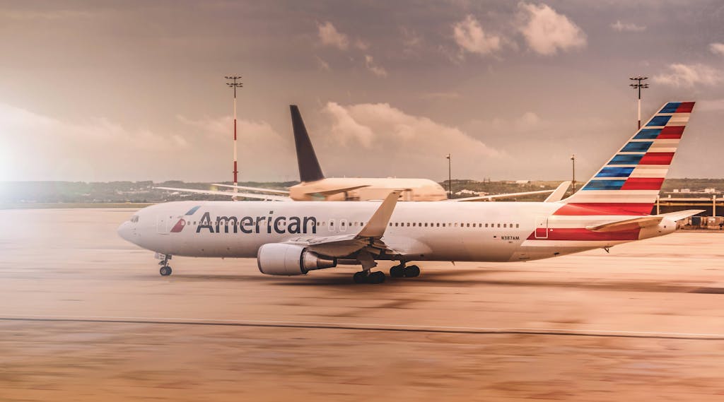 White American Airplane Parked on Airport