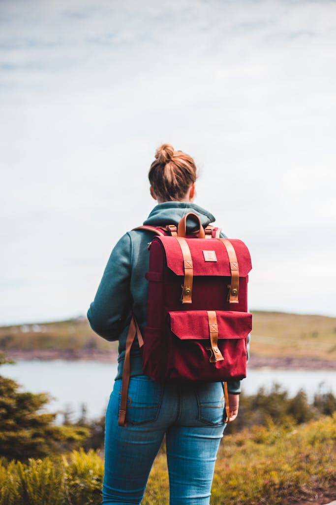 Woman Carrying Red Backpack