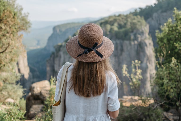 Woman in White Dress Wearing a Hat